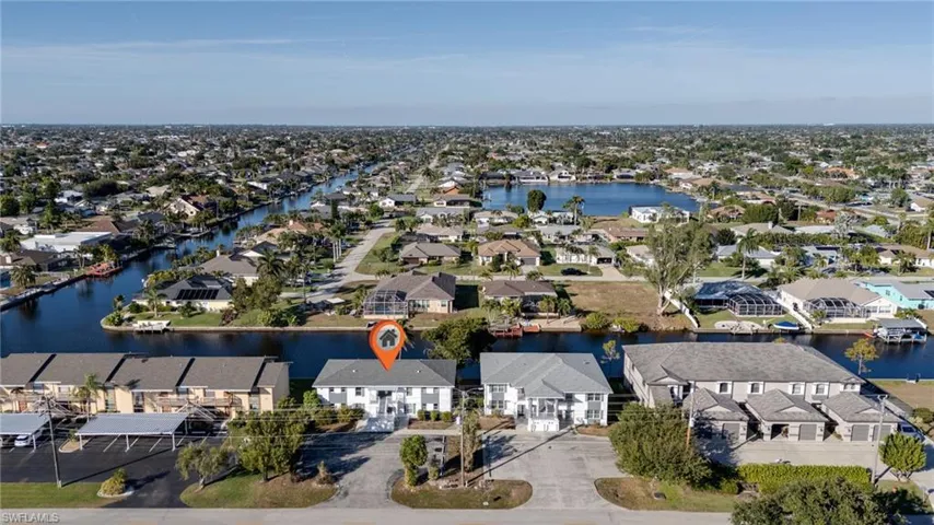 Aerial view of residential area with a large body of water