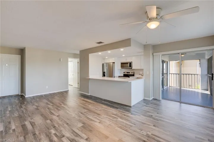 Unfurnished living room featuring ceiling fan, light wood-type flooring, and recessed lighting
