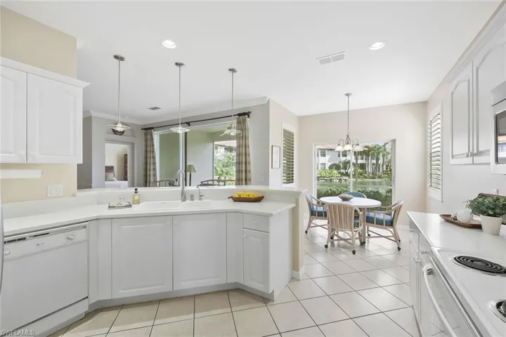 Even the breakfast nook has sparkling lake views with sliders to lanai and two windows for light and air.