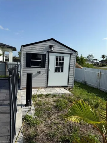 View of shed featuring a fenced backyard