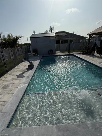 View of pool with a fenced backyard, a patio area, and a gazebo