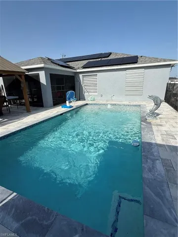 Outdoor pool with a patio