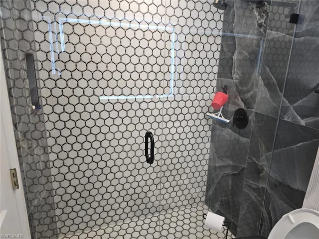 Bathroom featuring a shower stall
