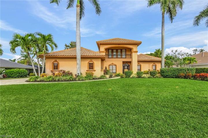 Very nice curb appeal with mature palms, new landscape.