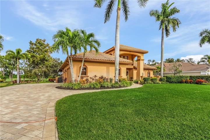 Long paver driveway offers plenty additional parking space for guests.