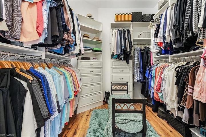 Huge walk-in master closet with built-ins.