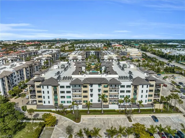 Multi-story residential building with private balconies and a central courtyard