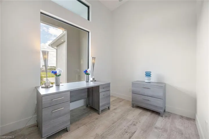 Office with baseboards and light wood finished floors