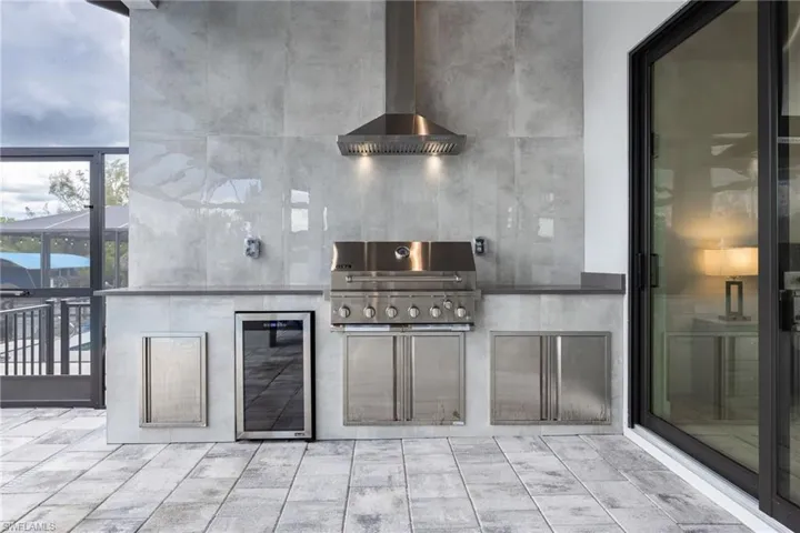 View of patio / terrace with wine cooler and area for grilling