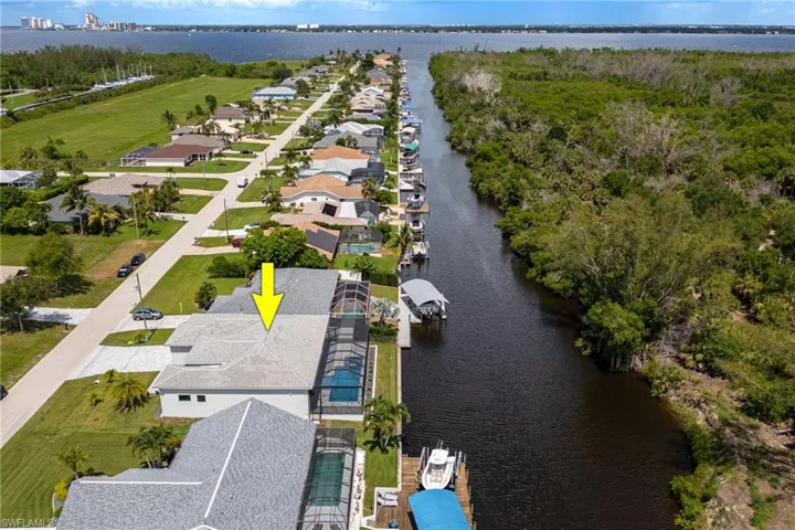Aerial view of residential area with a nearby body of water