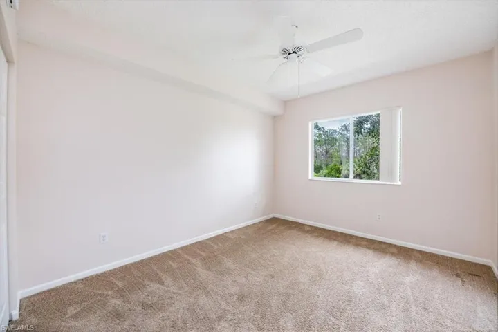 Unfurnished Guest Bedroom #2 featuring carpet flooring and ceiling fan