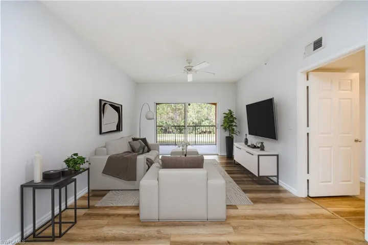 Virtually Staged Living room featuring hardwood / wood-style floors and ceiling fan