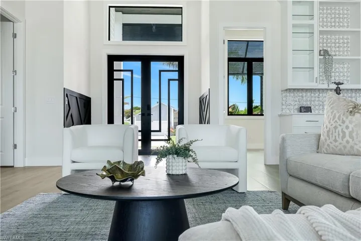 Living room featuring wood finished floors and french doors