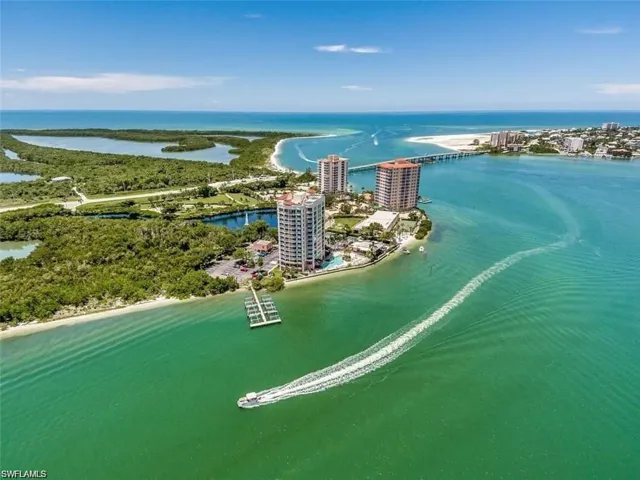 Birds eye view of property with a water view