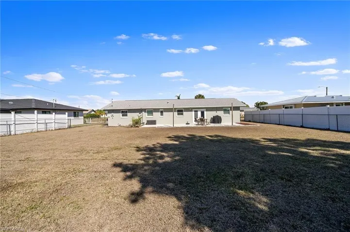Back of house featuring a patio area and a fenced backyard