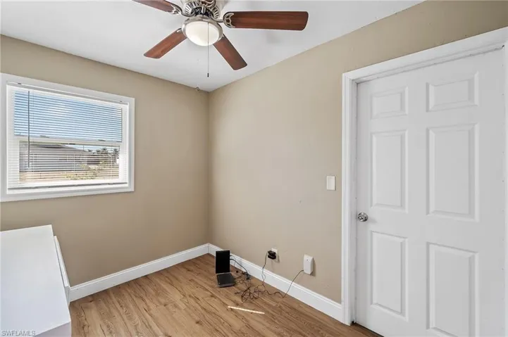 Unfurnished room with light wood-style flooring and ceiling fan