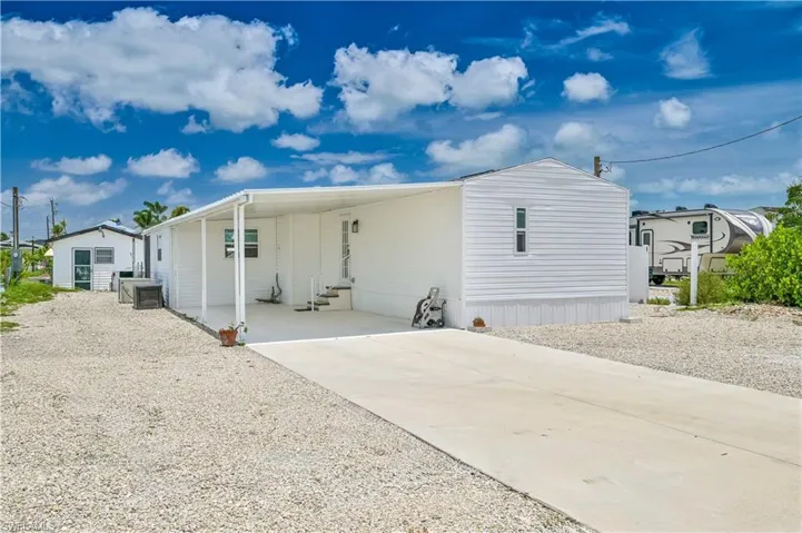 There is no longer a carport on the property , taken by the last hurricane. Property being sold AS-IS The unit is in great condition , just no carport.