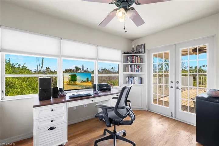 Carpeted bedroom with ceiling fan