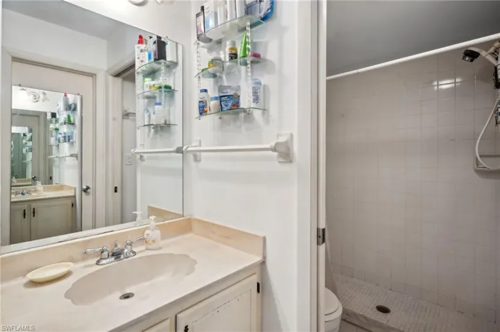 Bathroom with vanity and a shower stall