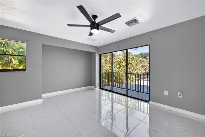 Primary bedroom 1 Unfurnished room featuring a ceiling fan and light marble finish flooring