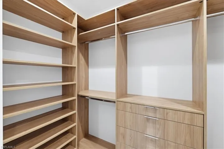 Walk in closet featuring light wood-style flooring