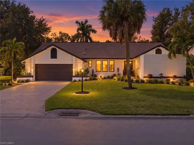 At dusk, the custom outdoor lighting softly illuminates the home's architecture and landscaping, creating a warm, elegant glow that welcomes you in.