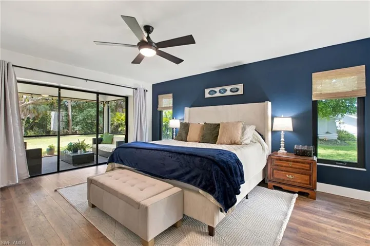 The primary suite opens directly to the lanai, letting in soft natural light and creating an easy connection between indoor comfort and outdoor living.