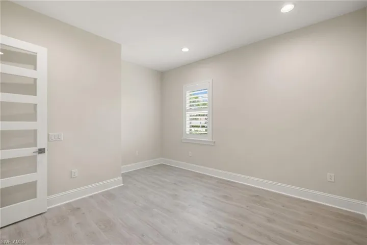 Den with glass french doors. Add a closet to easily convert to a 4th bedroom.