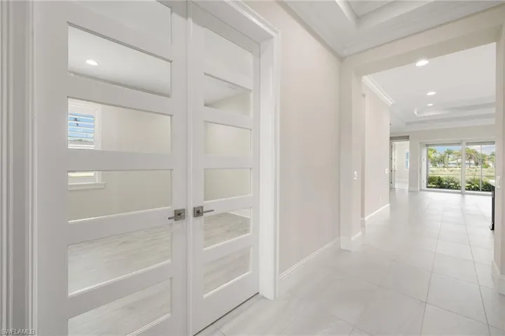 Foyer leading to den and kitchen