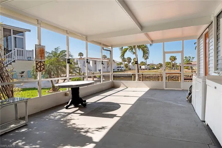 Sunroom featuring separate washer and dryer