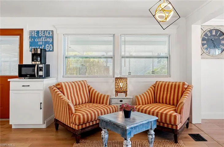 Living area with light hardwood / wood-style floors