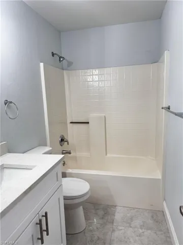 Bathroom with vanity and  shower combination