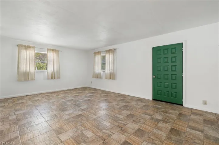 Unfurnished room with tile floors