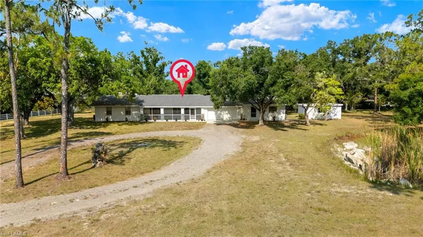 Single story home with a front yard