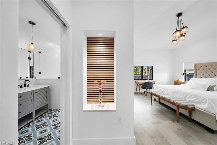 Bedroom with sink and hardwood / wood-style flooring
