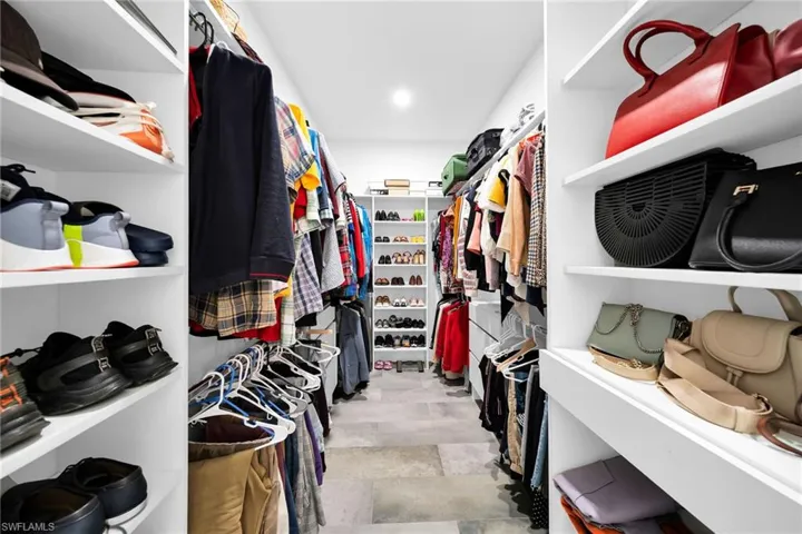 Spacious closet with light tile floors