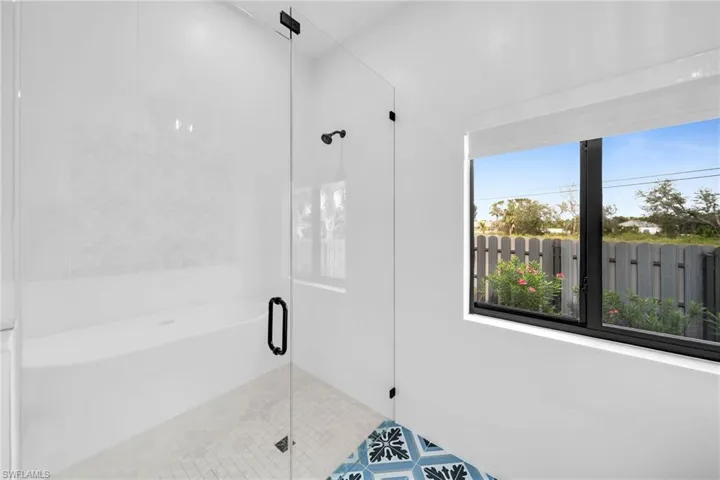 Bathroom featuring an enclosed shower