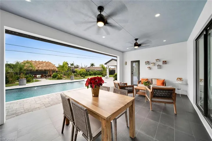 View of patio featuring ceiling fan and an outdoor hangout area