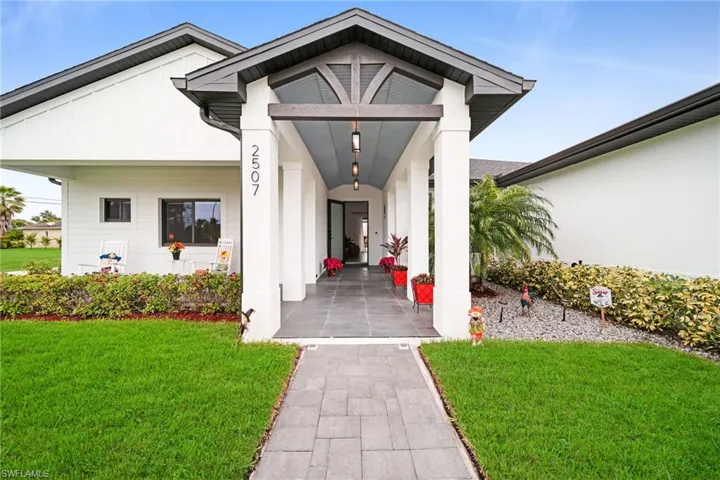 Property entrance with a lawn