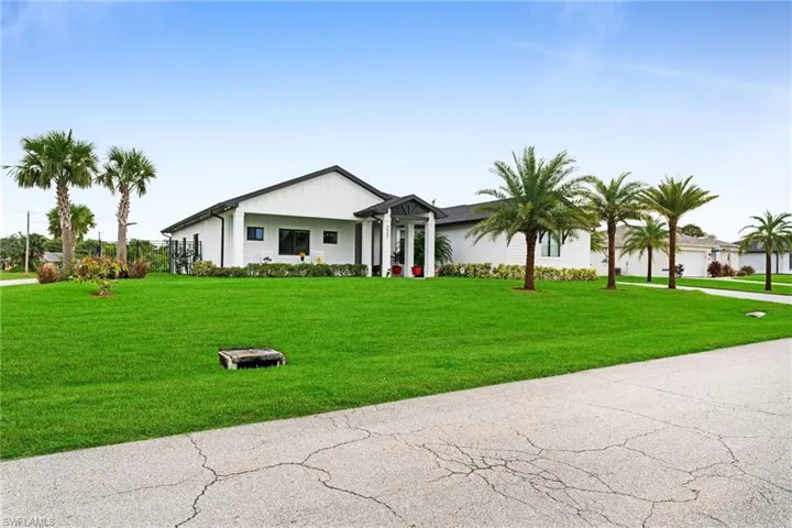 Single story home featuring a front lawn