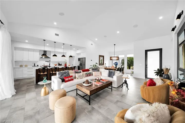 Living room with lofted ceiling