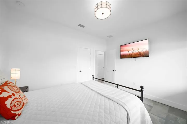 Bedroom with tile floors