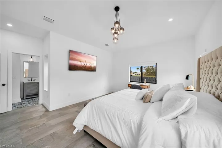 Bedroom with wood-type flooring