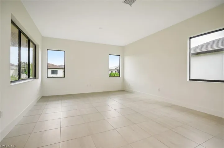 Spare room featuring light tile flooring