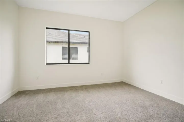 Unfurnished room with carpet