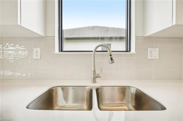 Interior details with sink and white cabinets