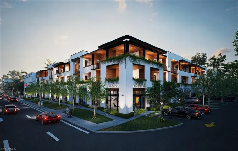 Property at dusk with a view of apartment building / complex