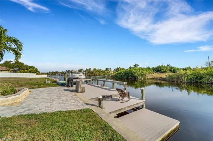 Dock area featuring a water view