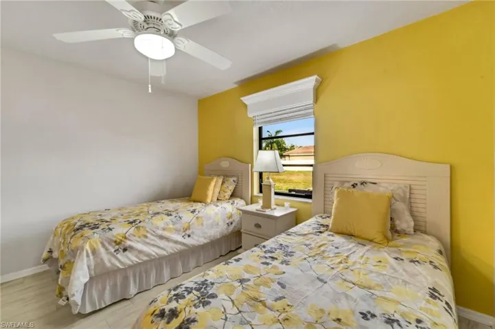 Bedroom featuring ceiling fan and light hardwood / wood-style flooring