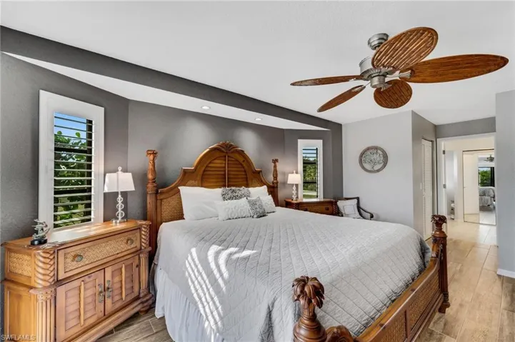 Bedroom featuring a closet, ceiling fan, and light hardwood / wood-style flooring